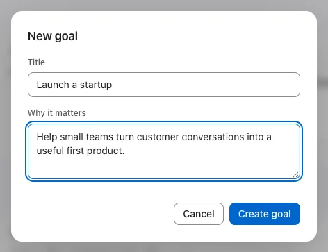 Desktop New goal dialog filled with Launch a startup and a reason: helping small teams turn customer conversations into a useful first product.