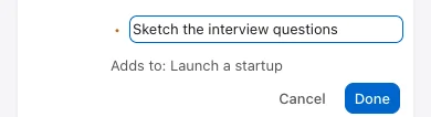 Phone task writer with an Adds to: Launch a startup parent label and Cancel and Done buttons.